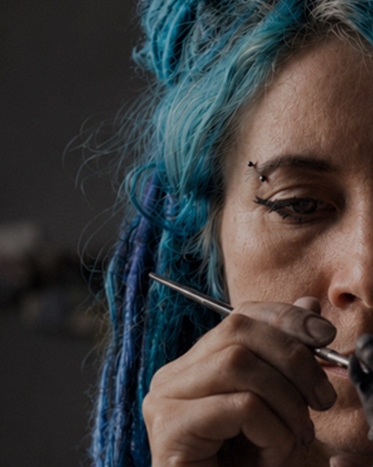 The maker of Dark Saga Art in her studio